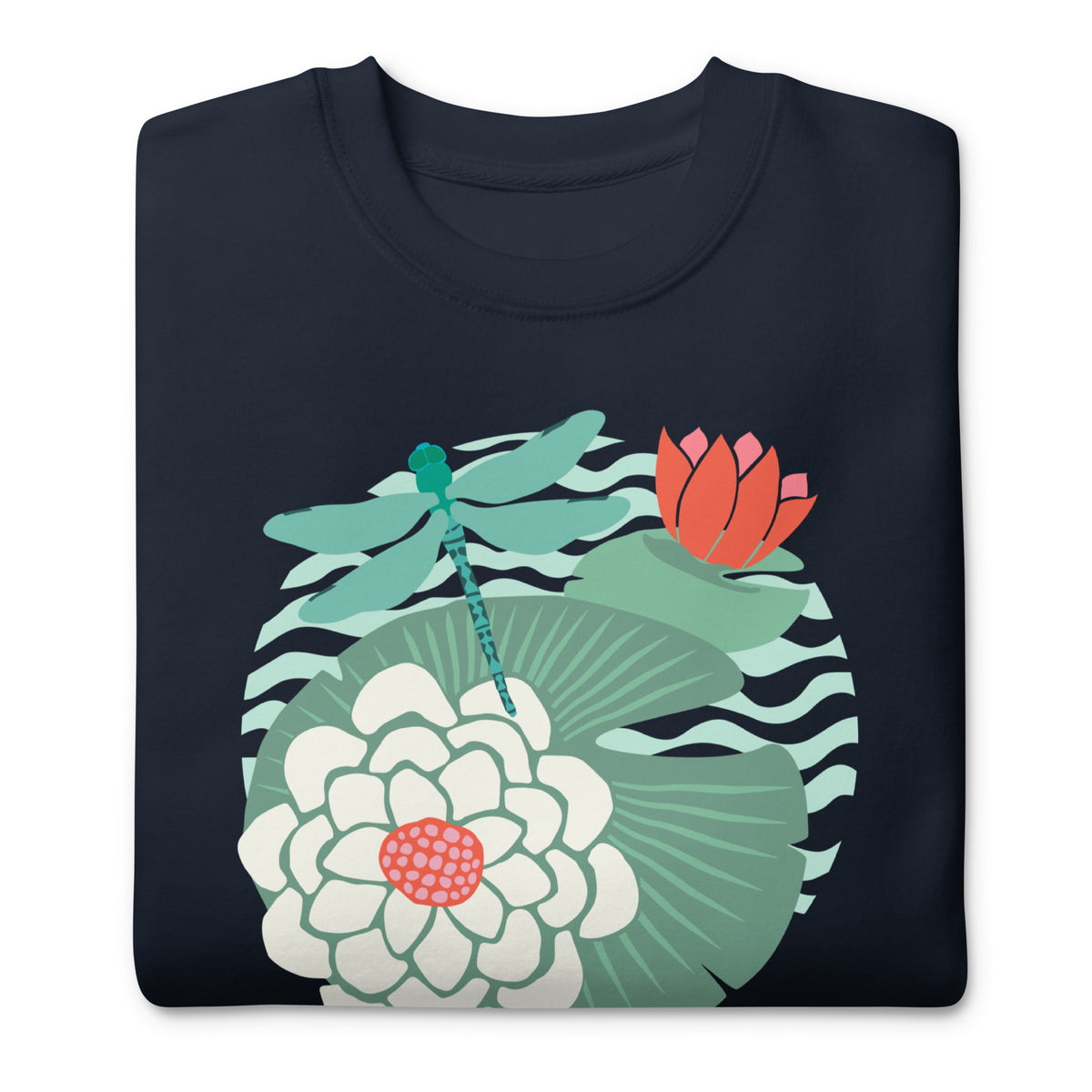 Dragonfly over water lilies and lily pads on a crewneck sweatshirt in navy, folded close-up of the design – Kate Spain design