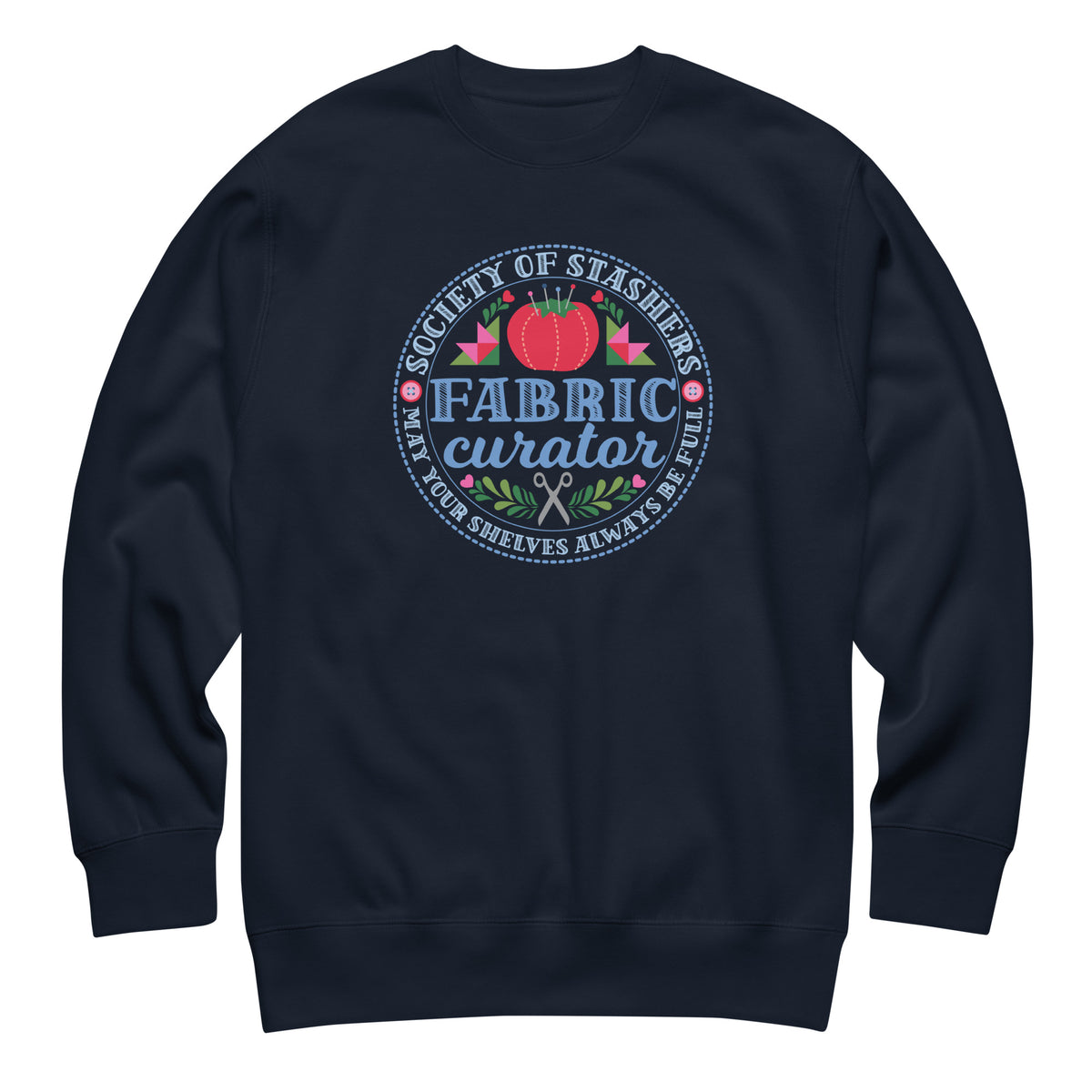 Fabric Curator Society of Stashers badge with a tomato pincushion on a crewneck sweatshirt in navy, front view – Kate Spain design for Pat Sloan