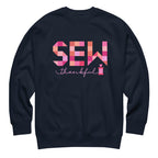 Sew Thankful patchwork lettering with a heart-topped thread spool on a crewneck sweatshirt in navy, front view – Kate Spain design for Pat Sloan