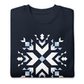 Let It Snow snowflake quilt block on a crewneck sweatshirt in navy, folded close-up of the design – Kate Spain design for Pat Sloan