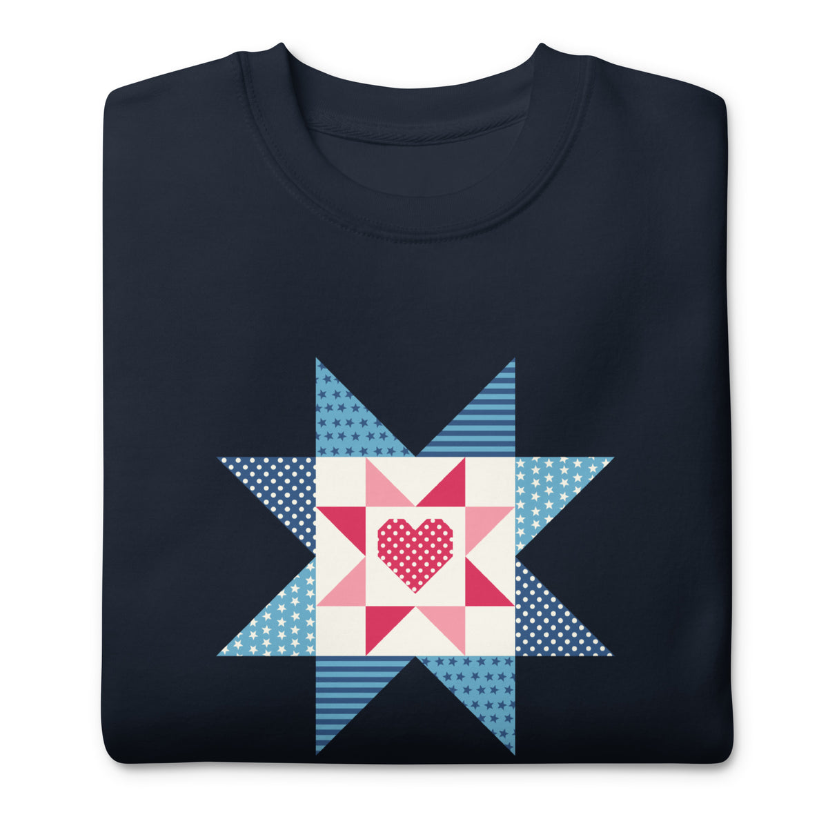 Liberty Love star quilt block with a heart in red, white and blue on a crewneck sweatshirt in navy, folded close-up of the design – Kate Spain design for Pat Sloan