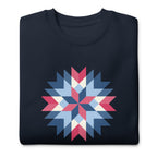 Barn Star quilt block in red, white and blue on a crewneck sweatshirt in navy, folded close-up of the design – Kate Spain design for Pat Sloan