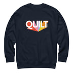 Moda QUILT logo with orange, pink, blue and yellow rays on a premium sweatshirt in navy, front view – Kate Spain design