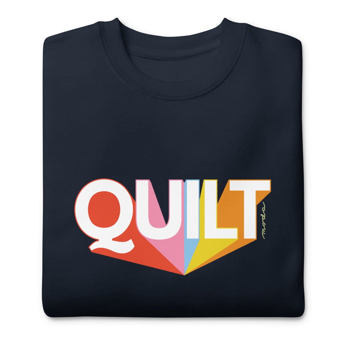 Moda QUILT logo with orange, pink, blue and yellow rays on a premium sweatshirt in navy, folded close-up of the design – Kate Spain design