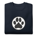 Law of the Paw® dog paw print on a crewneck sweatshirt in navy, folded close-up of the design – Kate Spain design
