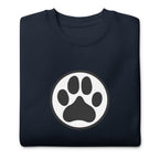 Law of the Paw® dog paw print on a crewneck sweatshirt in navy, folded close-up of the design – Kate Spain design