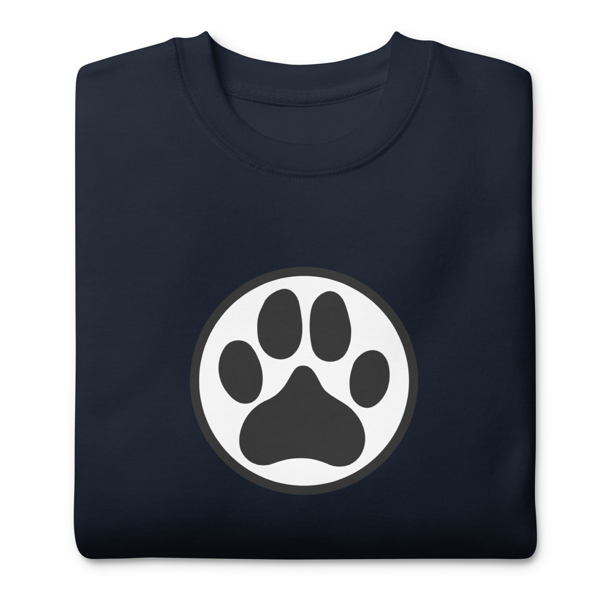 Law of the Paw® dog paw print on a crewneck sweatshirt in navy, folded close-up of the design – Kate Spain design