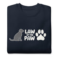 Law of the Paw® logo with seated dog and paw print on a crewneck sweatshirt in navy, folded close-up of the design – Kate Spain design