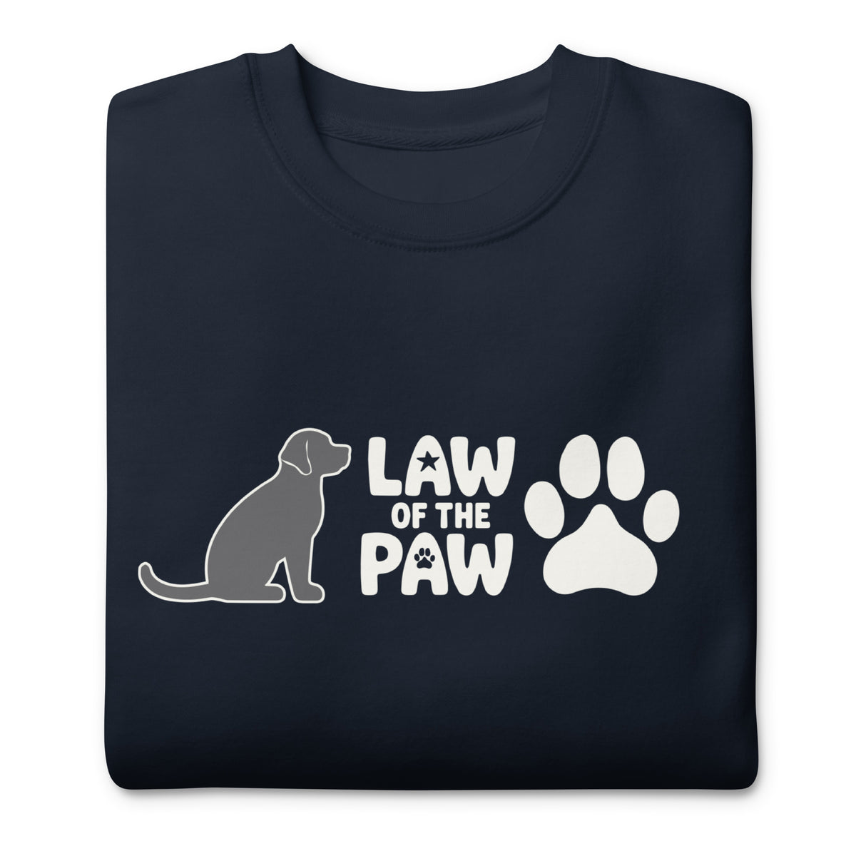 Law of the Paw® logo with seated dog and paw print on a crewneck sweatshirt in navy, folded close-up of the design – Kate Spain design