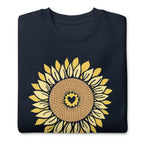 Golden sunflower with a heart center on a crewneck sweatshirt in navy, folded close-up of the design – Sunflowers in My Heart by Kate Spain