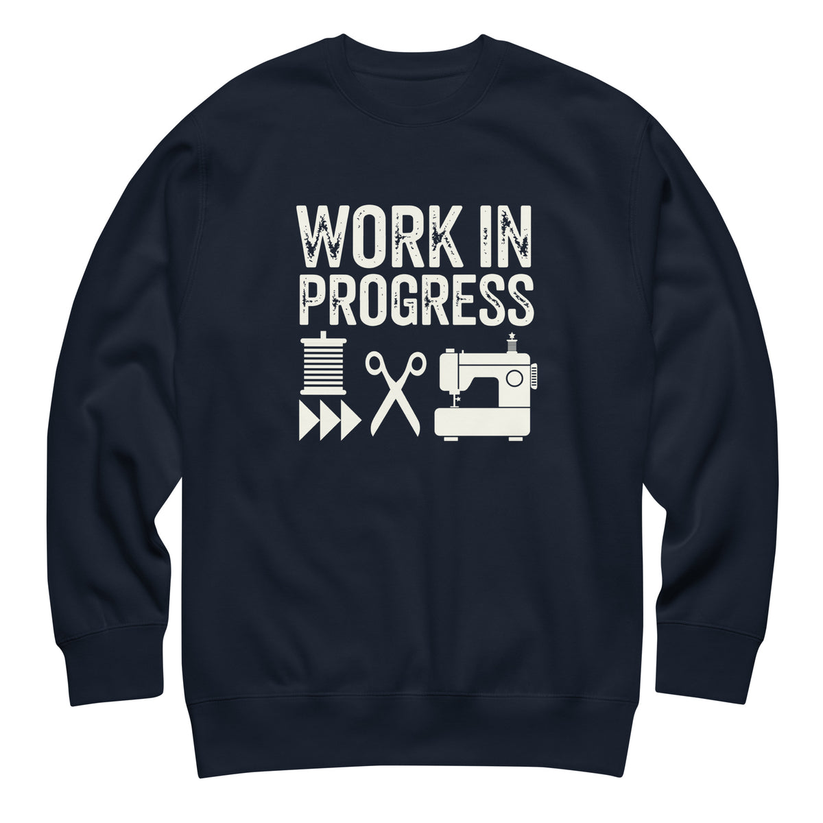 Work in Progress lettering with sewing icons on a premium sweatshirt in navy, front view – Kate Spain design for Pat Sloan
