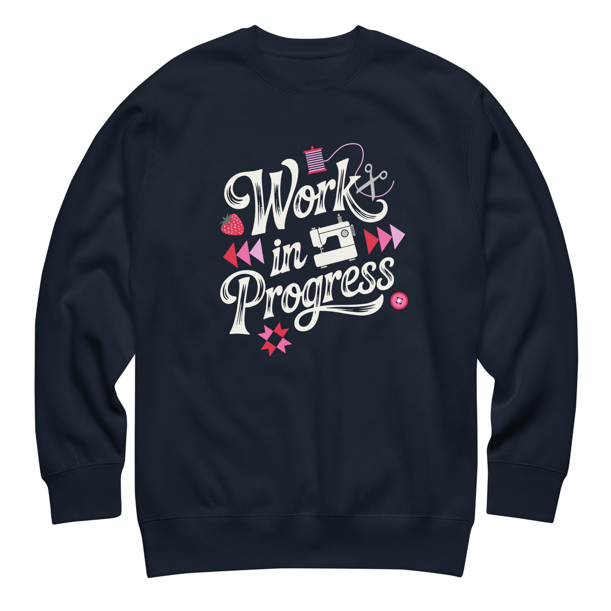 Work in Progress script lettering with sewing icons on a premium sweatshirt in navy, front view – Kate Spain design for Pat Sloan
