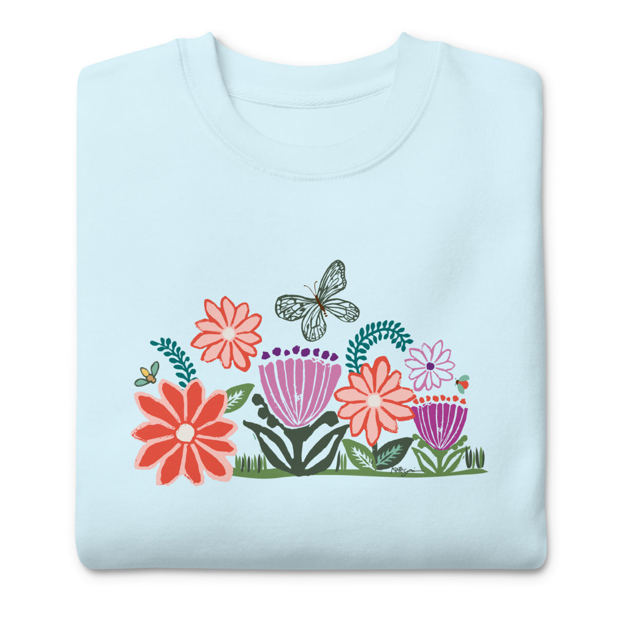 Bloom woodblock-style flowers with a butterfly, ladybug and bee on a crewneck sweatshirt in sky blue, folded close-up of the design – Kate Spain design