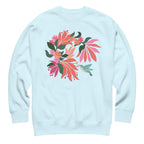 Hummingbird among coral tropical flowers on a crewneck sweatshirt in sky blue, front view – Kate Spain design