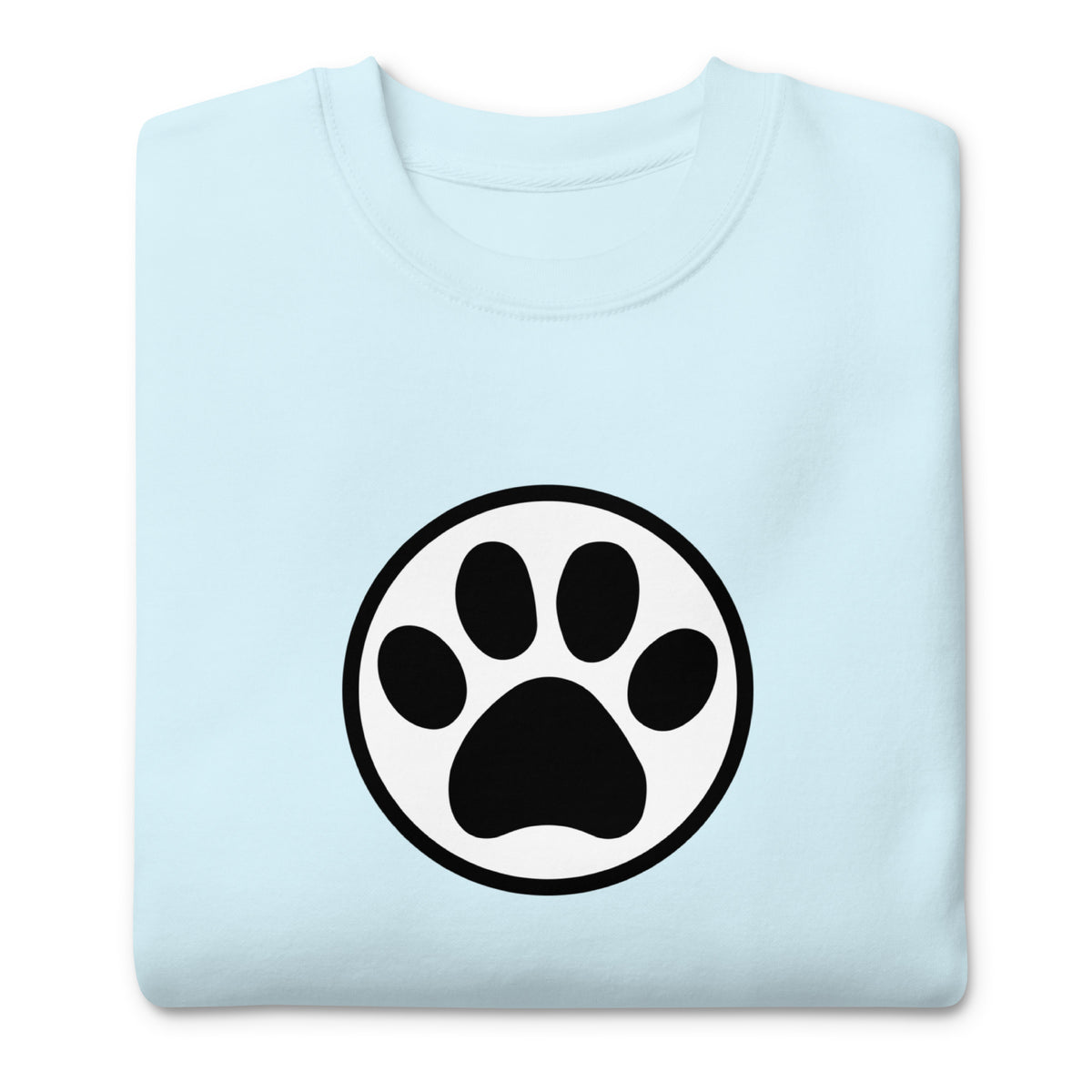 Law of the Paw® cat paw print on a crewneck sweatshirt in sky blue, folded close-up of the design – Kate Spain design