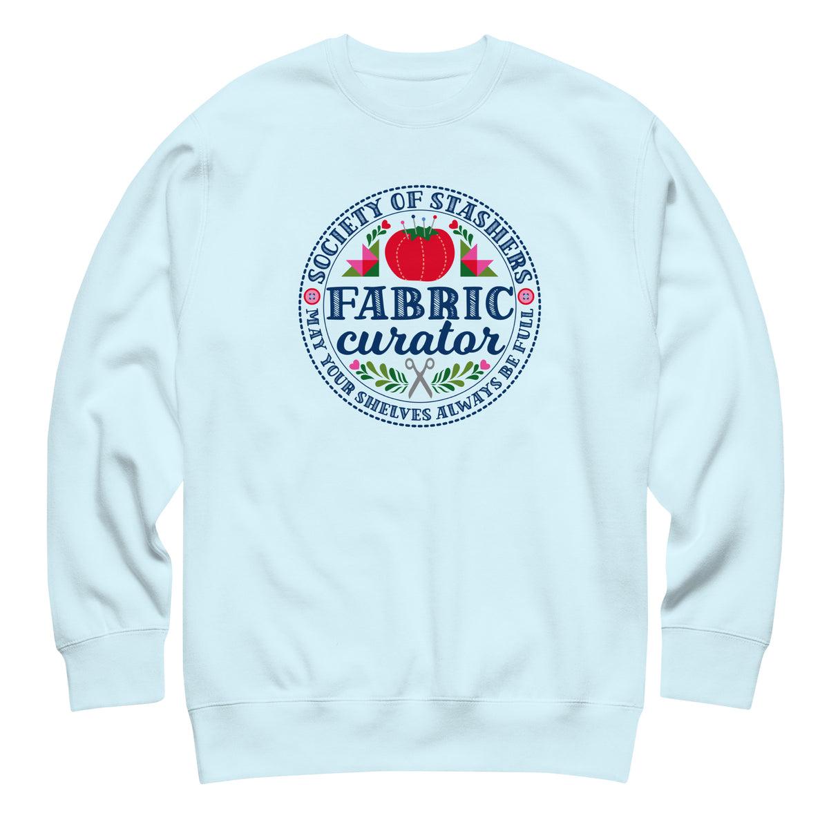 Fabric Curator Society of Stashers badge with a tomato pincushion on a crewneck sweatshirt in sky blue, front view – Kate Spain design for Pat Sloan