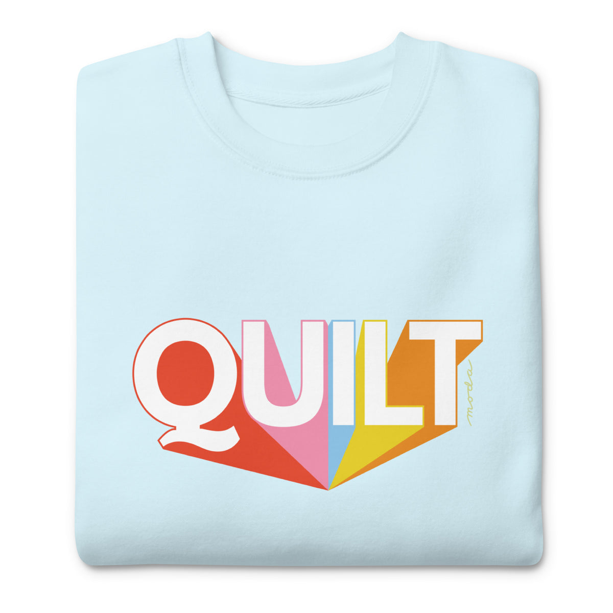Moda QUILT logo with orange, pink, blue and yellow rays on a premium sweatshirt in sky blue, folded close-up of the design – Kate Spain design