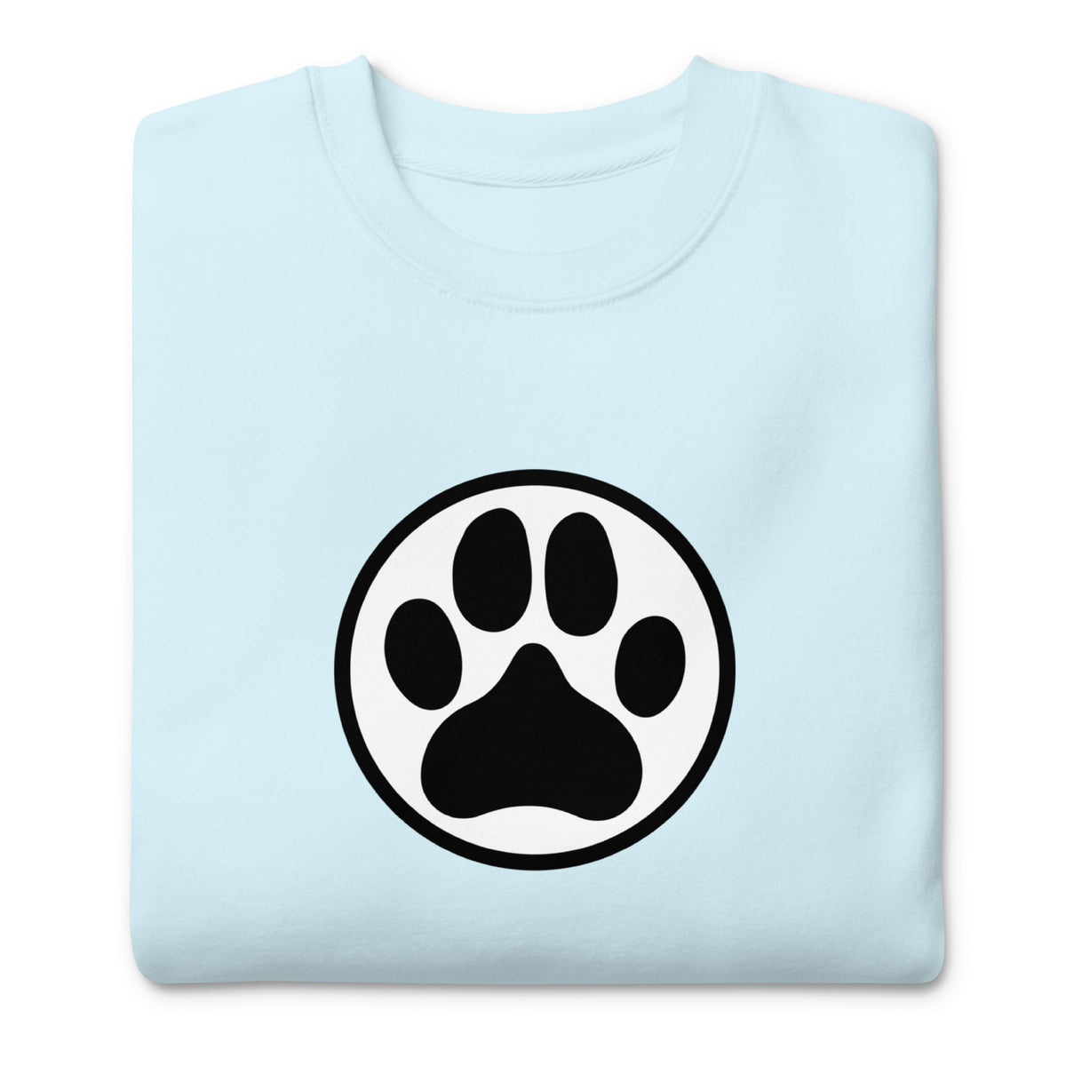 Law of the Paw® dog paw print on a crewneck sweatshirt in sky blue, folded close-up of the design – Kate Spain design