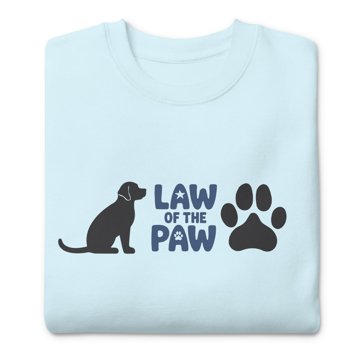 Law of the Paw® logo with seated dog and paw print on a crewneck sweatshirt in sky blue, folded close-up of the design – Kate Spain design
