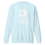 May the ¼" Be With You white sewing machine graphic on a premium sweatshirt in sky blue, folded close-up of the design – Kate Spain design for Pat Sloan