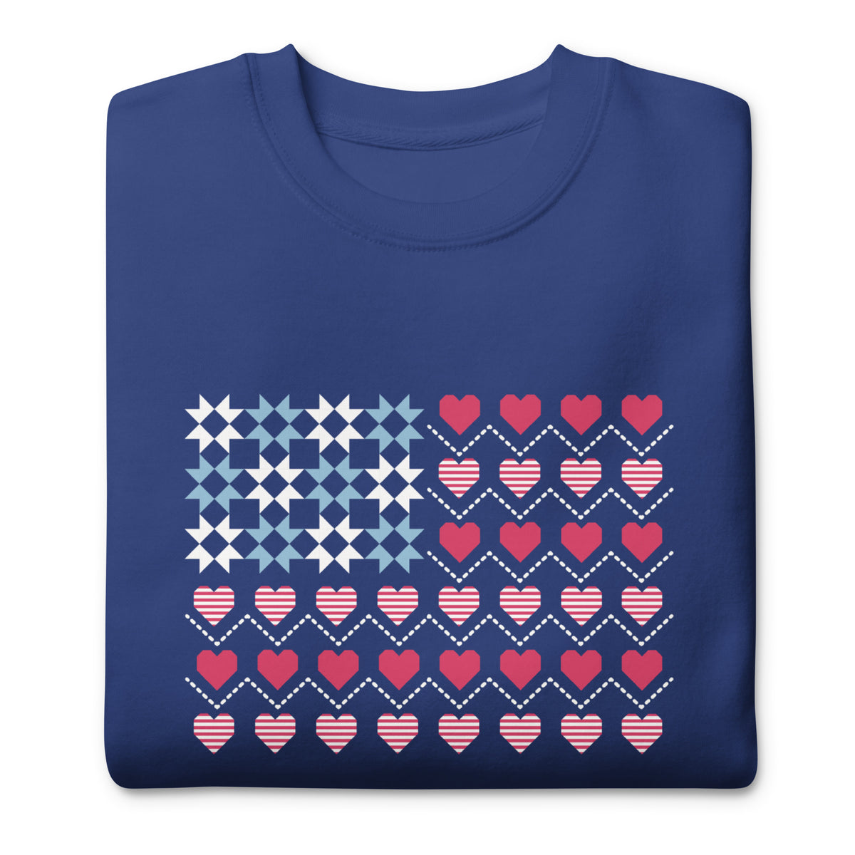 United We Quilt patchwork flag with quilt-block stars and heart stripes on a crewneck sweatshirt in royal blue, folded close-up of the design – Kate Spain design for Pat Sloan
