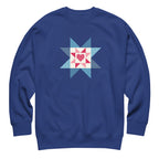 Liberty Love star quilt block with a heart in red, white and blue on a crewneck sweatshirt in royal blue, front view – Kate Spain design for Pat Sloan