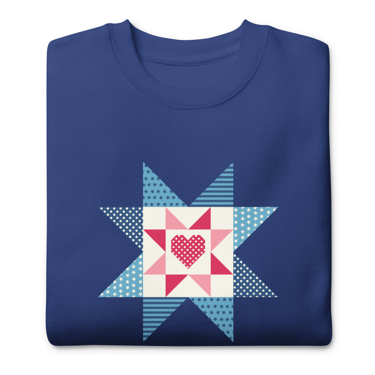 Liberty Love star quilt block with a heart in red, white and blue on a crewneck sweatshirt in royal blue, folded close-up of the design – Kate Spain design for Pat Sloan