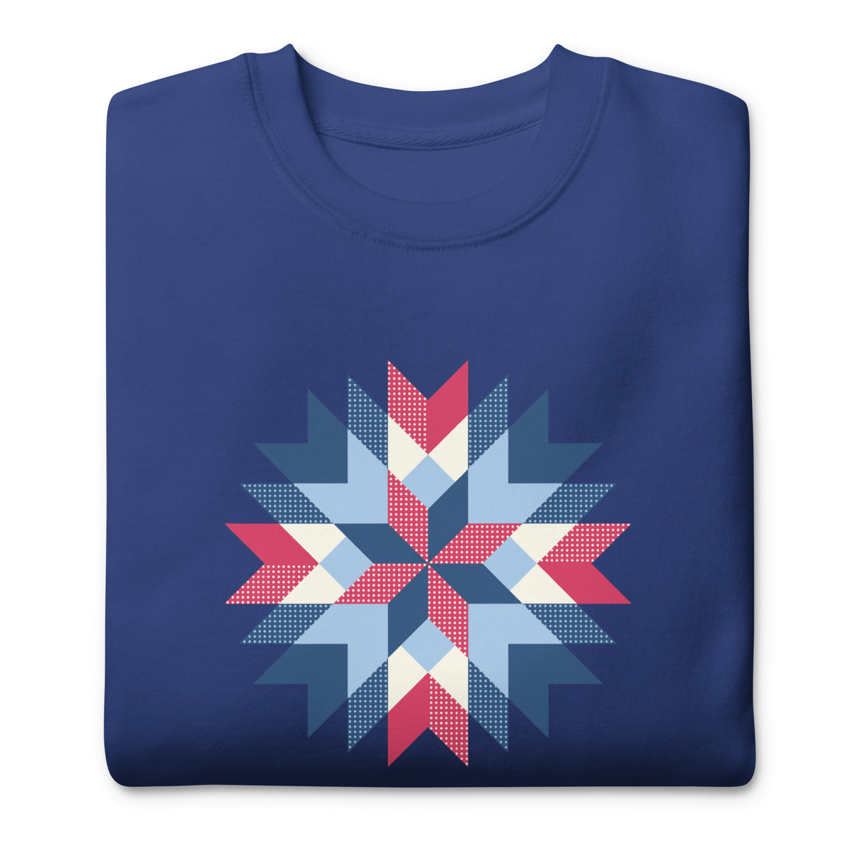 Barn Star quilt block in red, white and blue on a crewneck sweatshirt in royal blue, folded close-up of the design – Kate Spain design for Pat Sloan