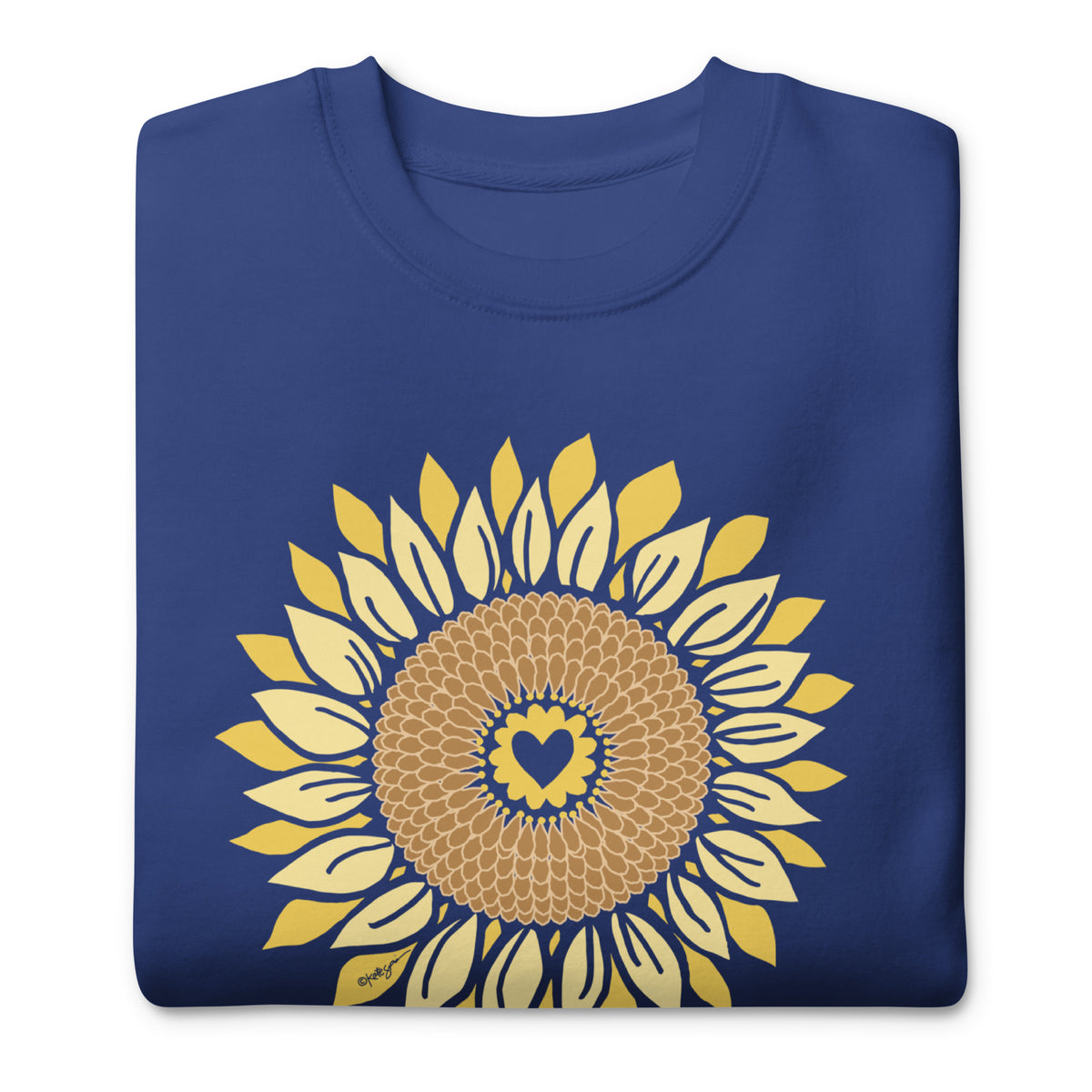 Golden sunflower with a heart center on a crewneck sweatshirt in royal blue, folded close-up of the design – Sunflowers in My Heart by Kate Spain