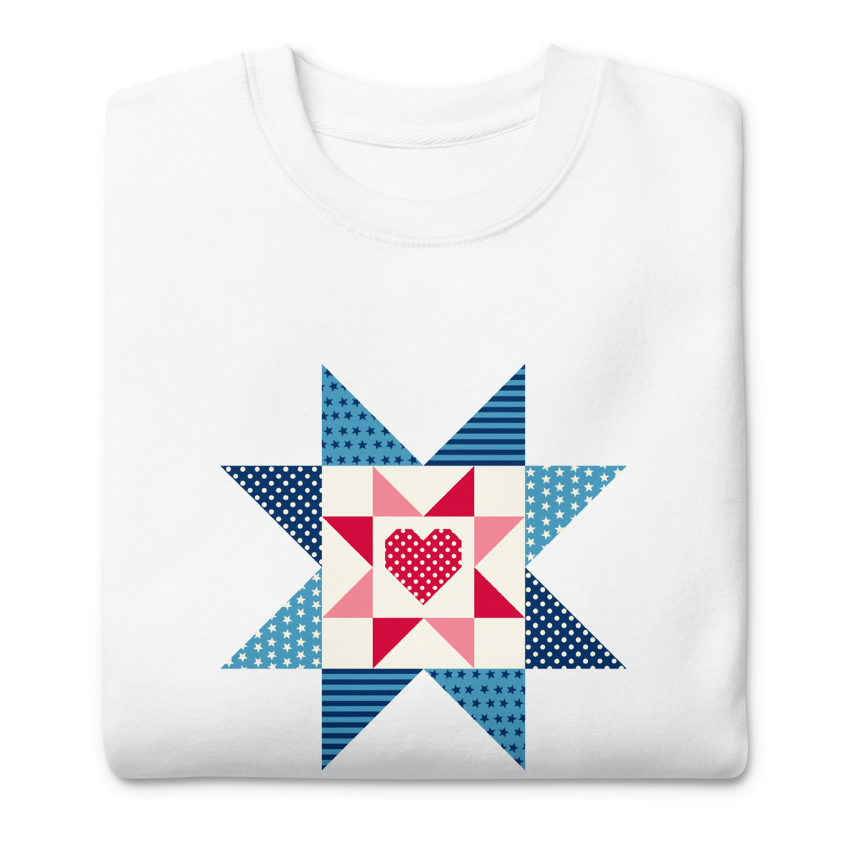 Liberty Love star quilt block with a heart in red, white and blue on a crewneck sweatshirt in white, folded close-up of the design – Kate Spain design for Pat Sloan
