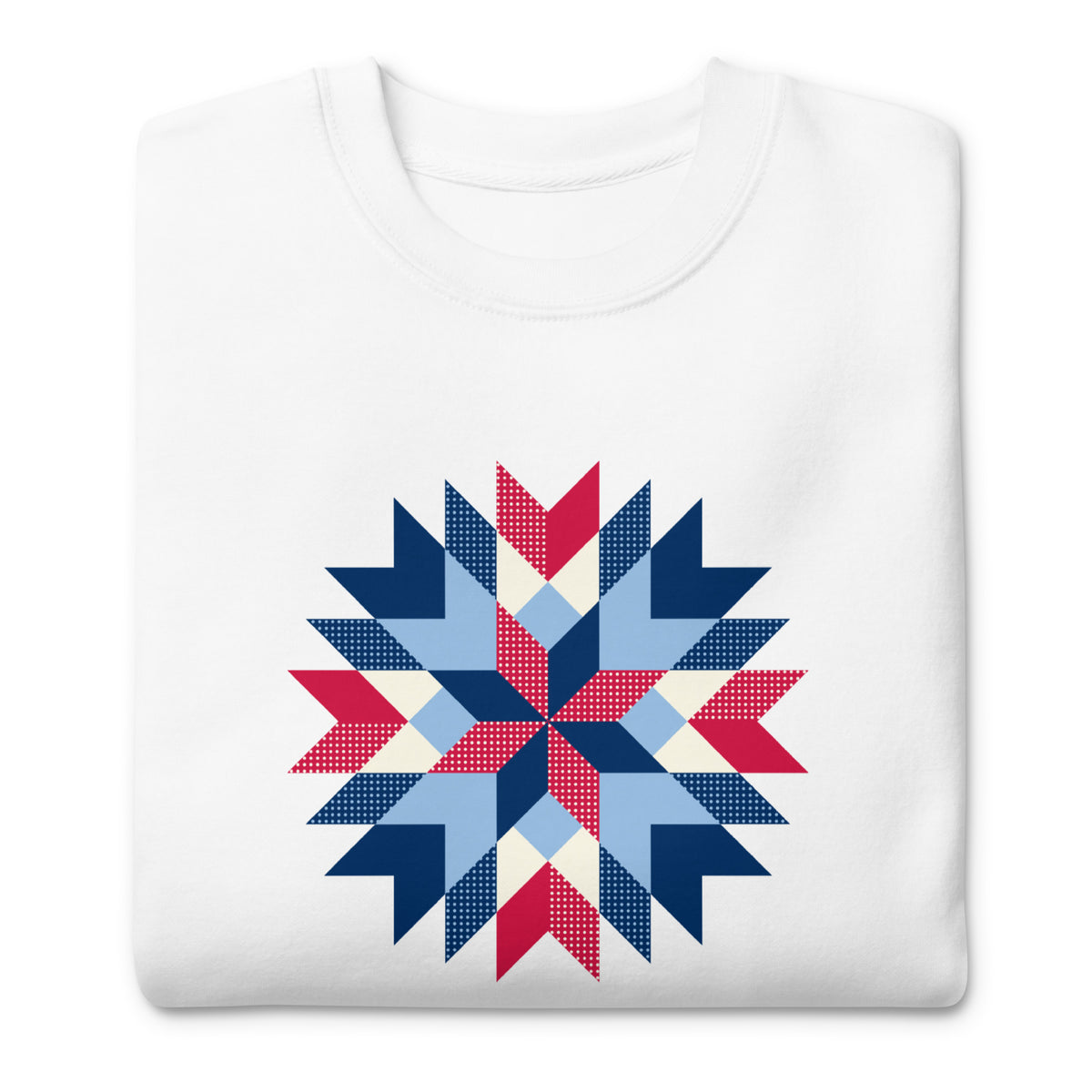 Barn Star quilt block in red, white and blue on a crewneck sweatshirt in white, folded close-up of the design – Kate Spain design for Pat Sloan