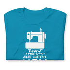 May the ¼" Be With You white sewing machine graphic on a staple t-shirt in aqua, folded close-up of the design – Kate Spain design for Pat Sloan