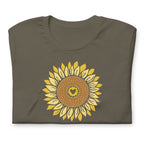 Golden sunflower with a heart center on a crewneck t-shirt in army green, folded close-up of the design – Sunflowers in My Heart by Kate Spain