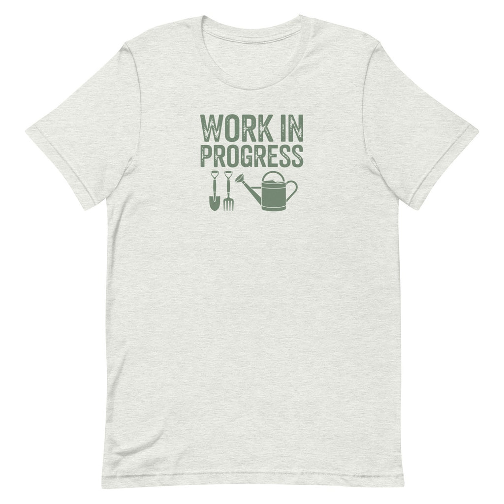 Garden Work in Progress distressed lettering with a shovel, pitchfork and watering can on a t-shirt in ash, front view – Kate Spain design