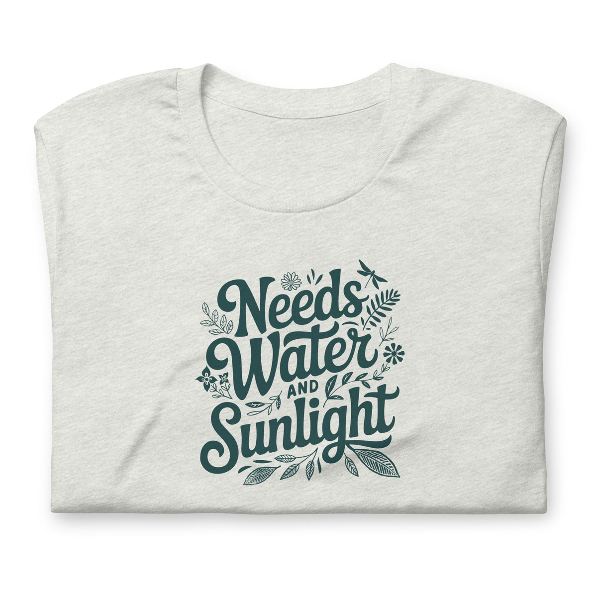 Needs Water + Sunlight hand lettering with leaf and sun accents on a t-shirt in ash, folded close-up of the design – Kate Spain design