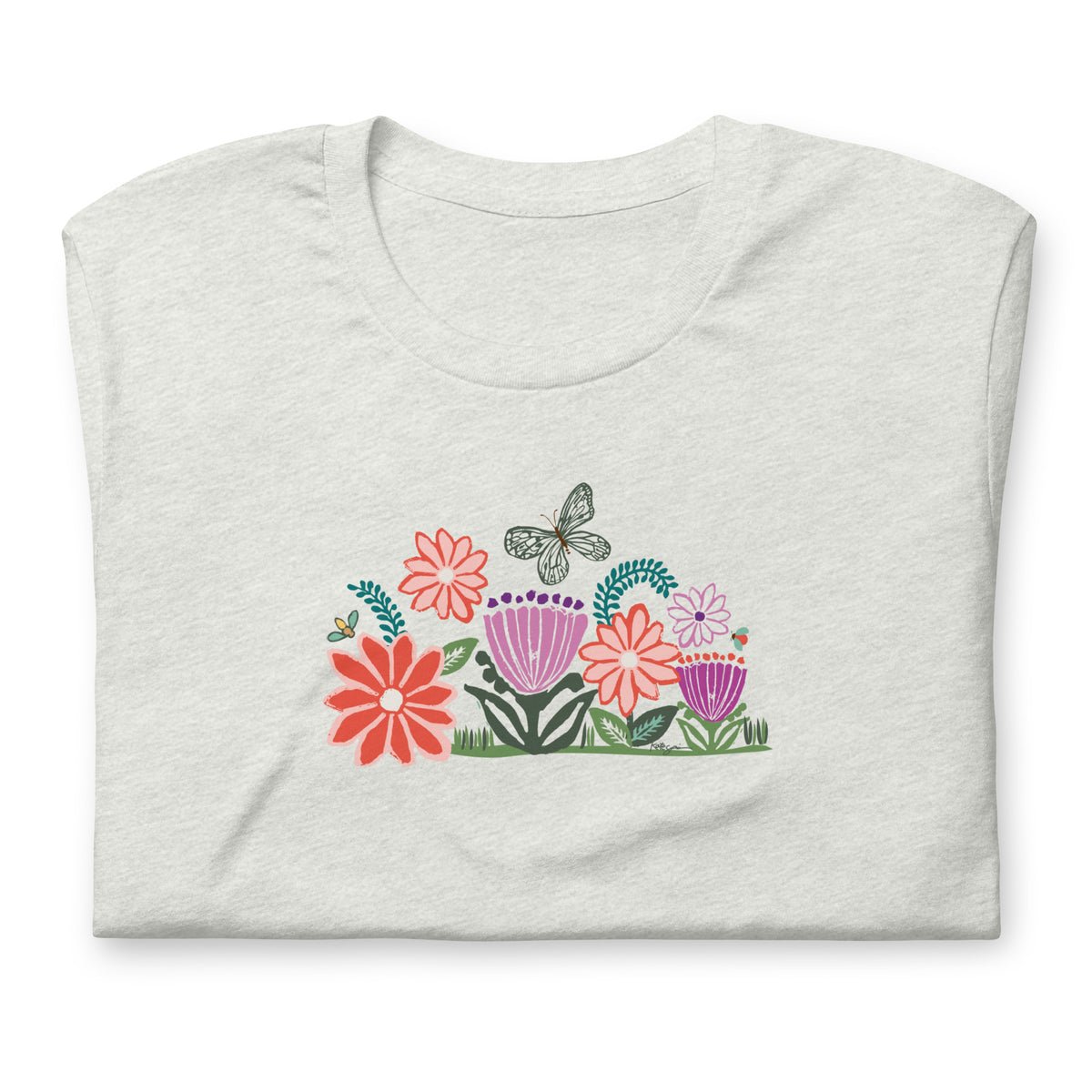 Bloom woodblock-style flowers with a butterfly, ladybug and bee on a t-shirt in ash, folded close-up of the design – Kate Spain design