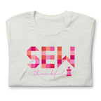Sew Thankful patchwork lettering with a heart-topped thread spool on a t-shirt in ash, folded close-up of the design – Kate Spain design for Pat Sloan