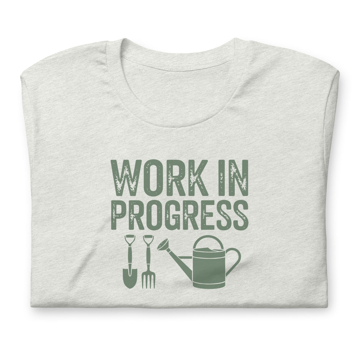 Garden Work in Progress distressed lettering with a shovel, pitchfork and watering can on a t-shirt in ash, folded close-up of the design – Kate Spain design