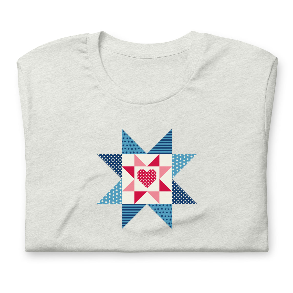 Liberty Love star quilt block with a heart in red, white and blue on a t-shirt in ash, folded close-up of the design – Kate Spain design for Pat Sloan