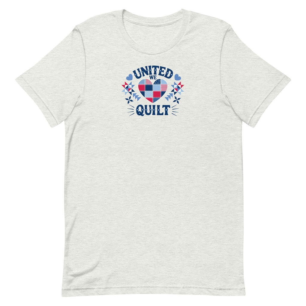 Quilters United quilt badge in red, white and blue on a t-shirt in ash, front view – Kate Spain design for Pat Sloan