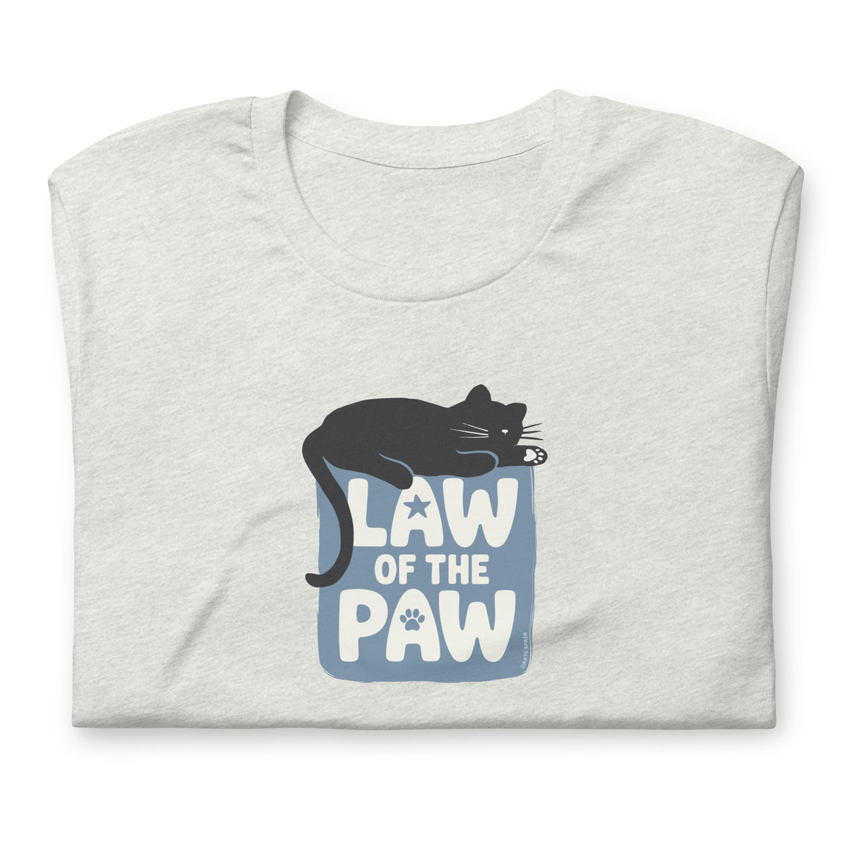 Law of the Paw® design with a cat napping on the logo on a t-shirt in ash, folded close-up of the design – Kate Spain design