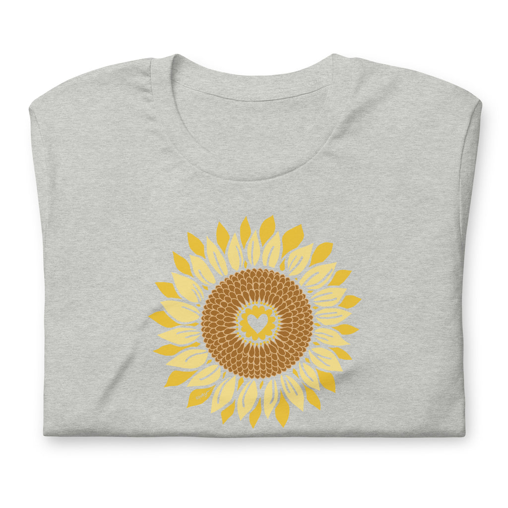 Golden sunflower with a heart center on a crewneck t-shirt in athletic heather grey, folded close-up of the design – Sunflowers in My Heart by Kate Spain