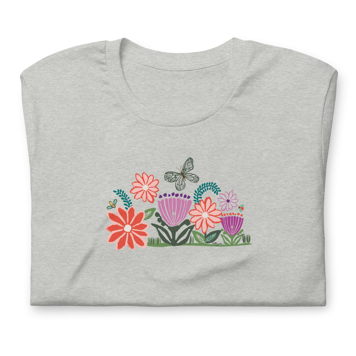 Bloom woodblock-style flowers with a butterfly, ladybug and bee on a t-shirt in athletic heather grey, folded close-up of the design – Kate Spain design