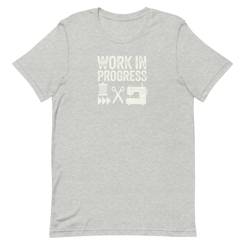 Work in Progress Mod distressed lettering with thread, scissors and sewing machine on a t-shirt in athletic heather grey, front view – Kate Spain design for Pat Sloan