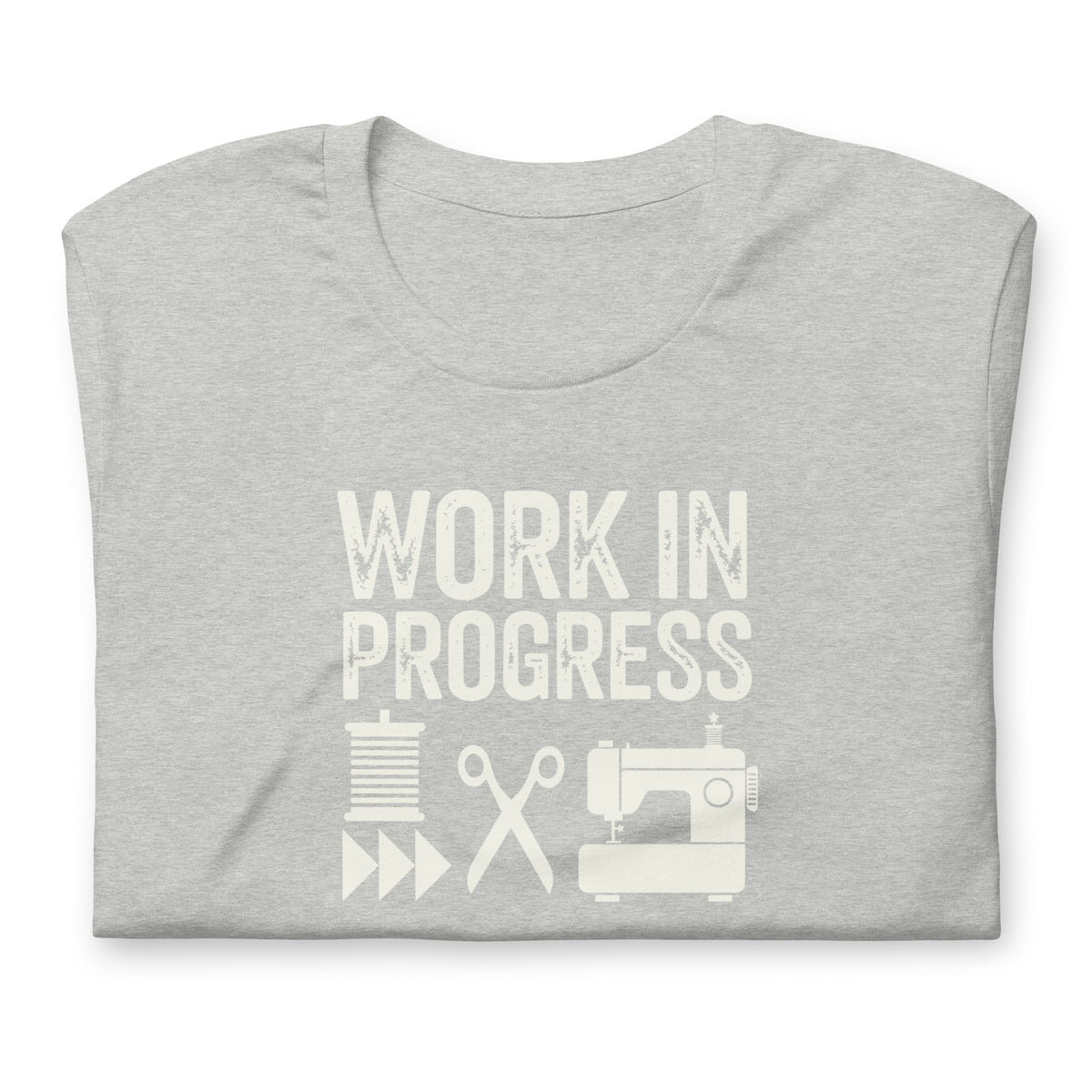 Work in Progress Mod distressed lettering with thread, scissors and sewing machine on a t-shirt in athletic heather grey, folded close-up of the design – Kate Spain design for Pat Sloan