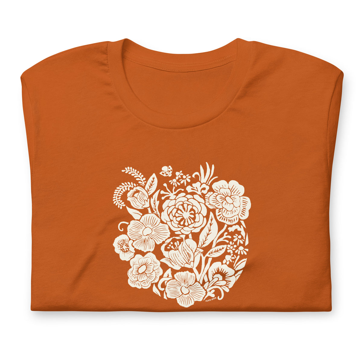 Meadowsweet woodblock-style bouquet of wildflowers on a t-shirt in autumn, folded close-up of the design – Kate Spain design