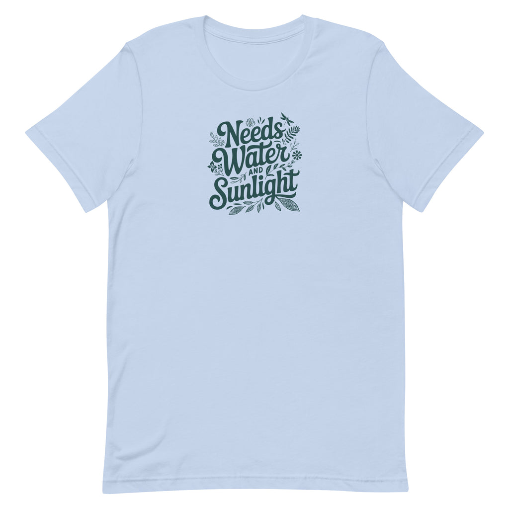 Needs Water + Sunlight hand lettering with leaf and sun accents on a t-shirt in light blue, front view – Kate Spain design