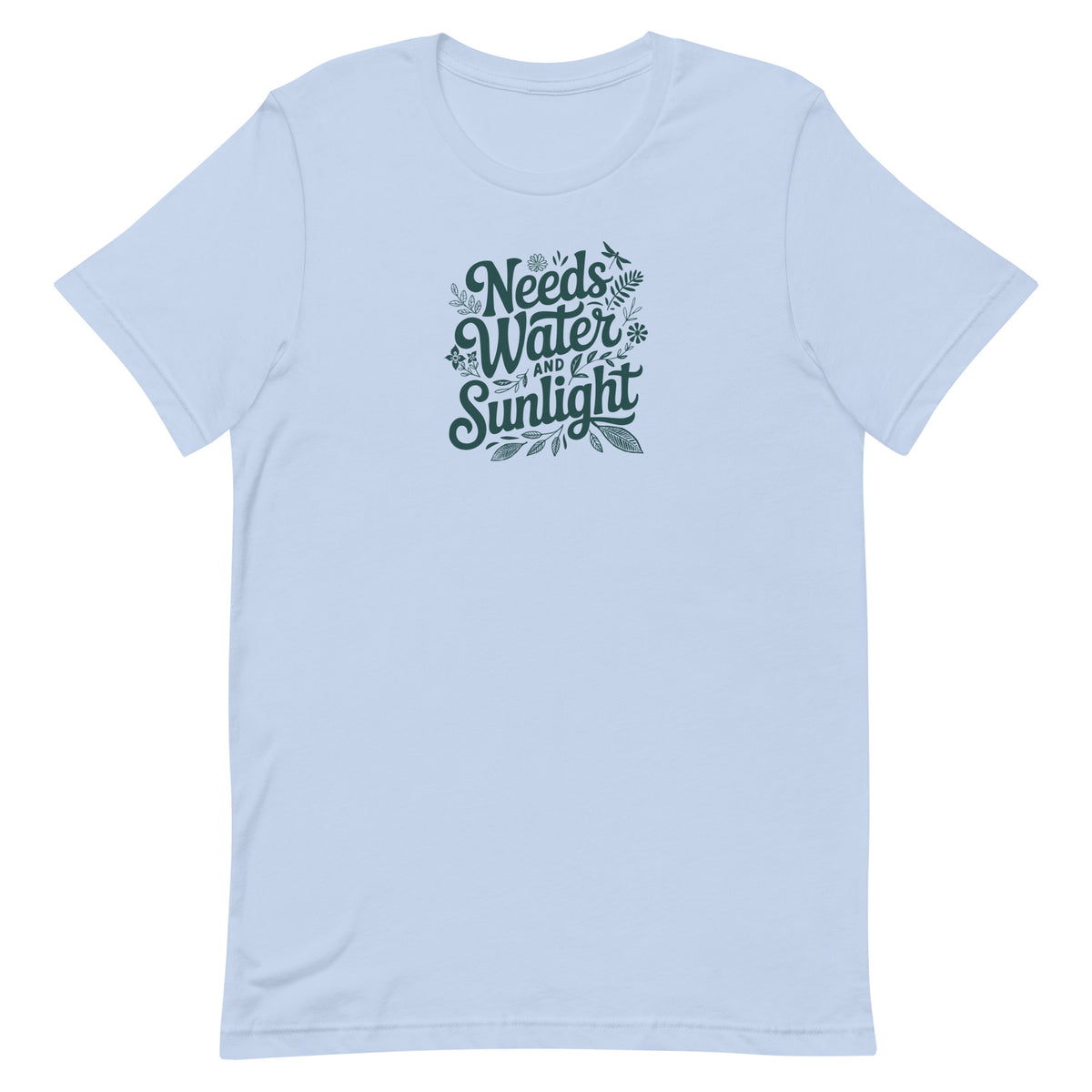 Needs Water + Sunlight hand lettering with leaf and sun accents on a t-shirt in light blue, front view – Kate Spain design