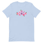 Pink GeoFlora hexagon flowers in pinks, mauves and sage on a t-shirt in light blue, front view – Kate Spain design for Pat Sloan