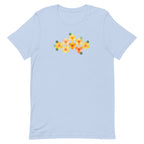 Yellow GeoFlora hexagon flowers in golden yellow, orange, coral and sage on a t-shirt in light blue, front view – Kate Spain design for Pat Sloan